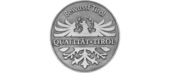 Round metal plaque with eagle and text Quality Tirol Conscious Tirol